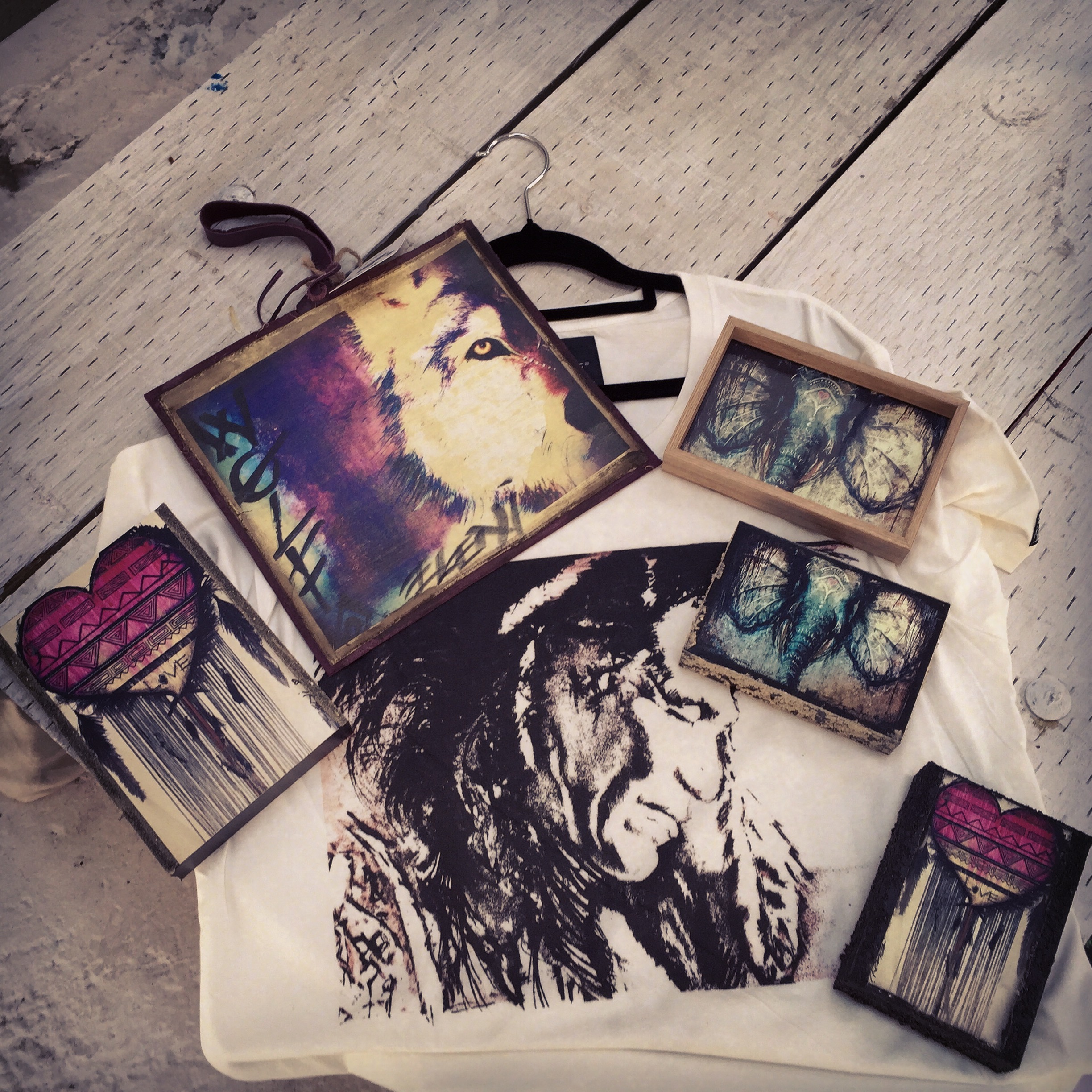 Art work for sale... leather clutch bags, t shirts, picture frames 